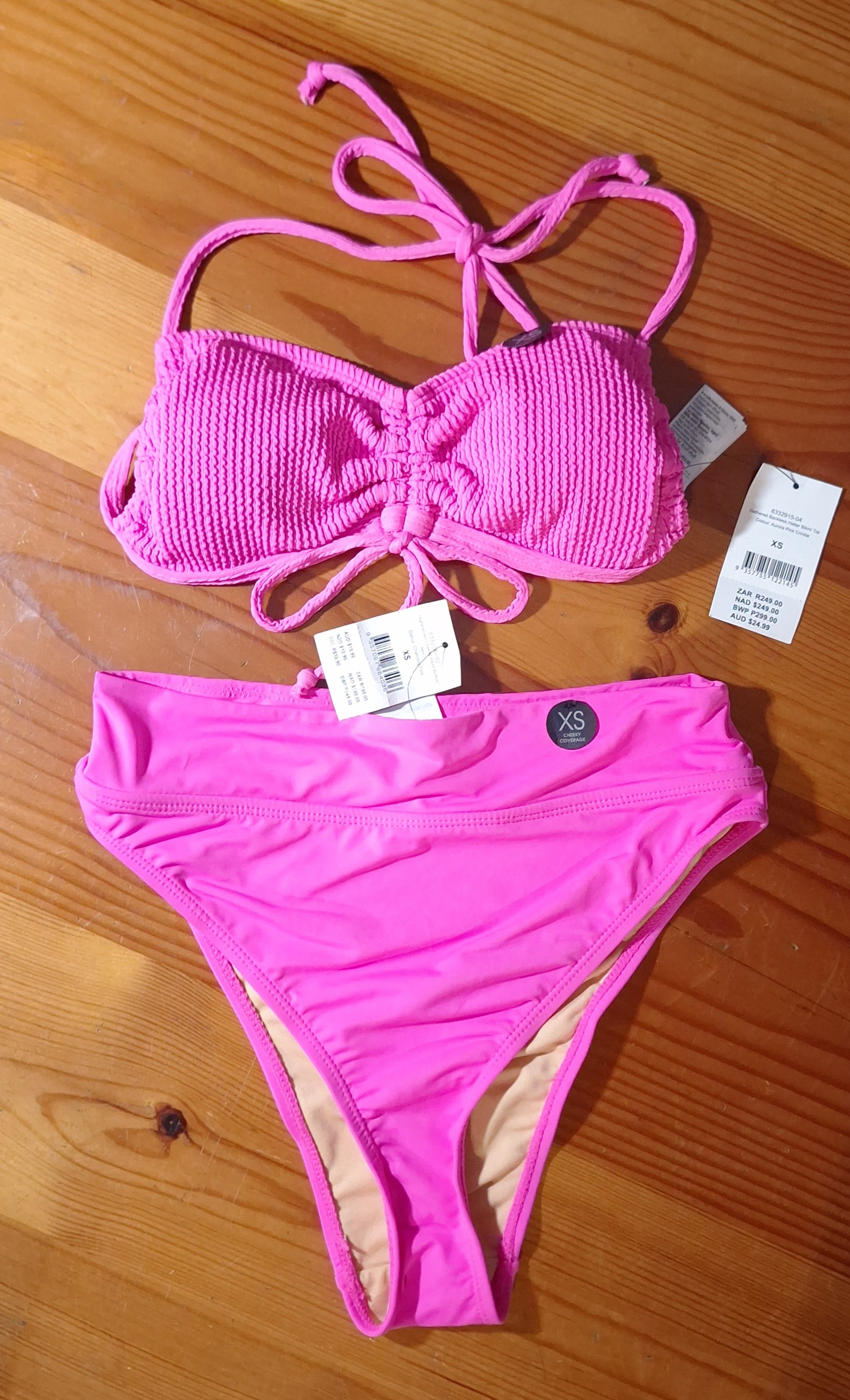 Cotton On Bikini Set  Gathered Backless Halter Bikini Top. Colour: Aurora Pink Crinkle.  High-Waisted Cheeky Bikini Bottom. Colour: Charming Pink.