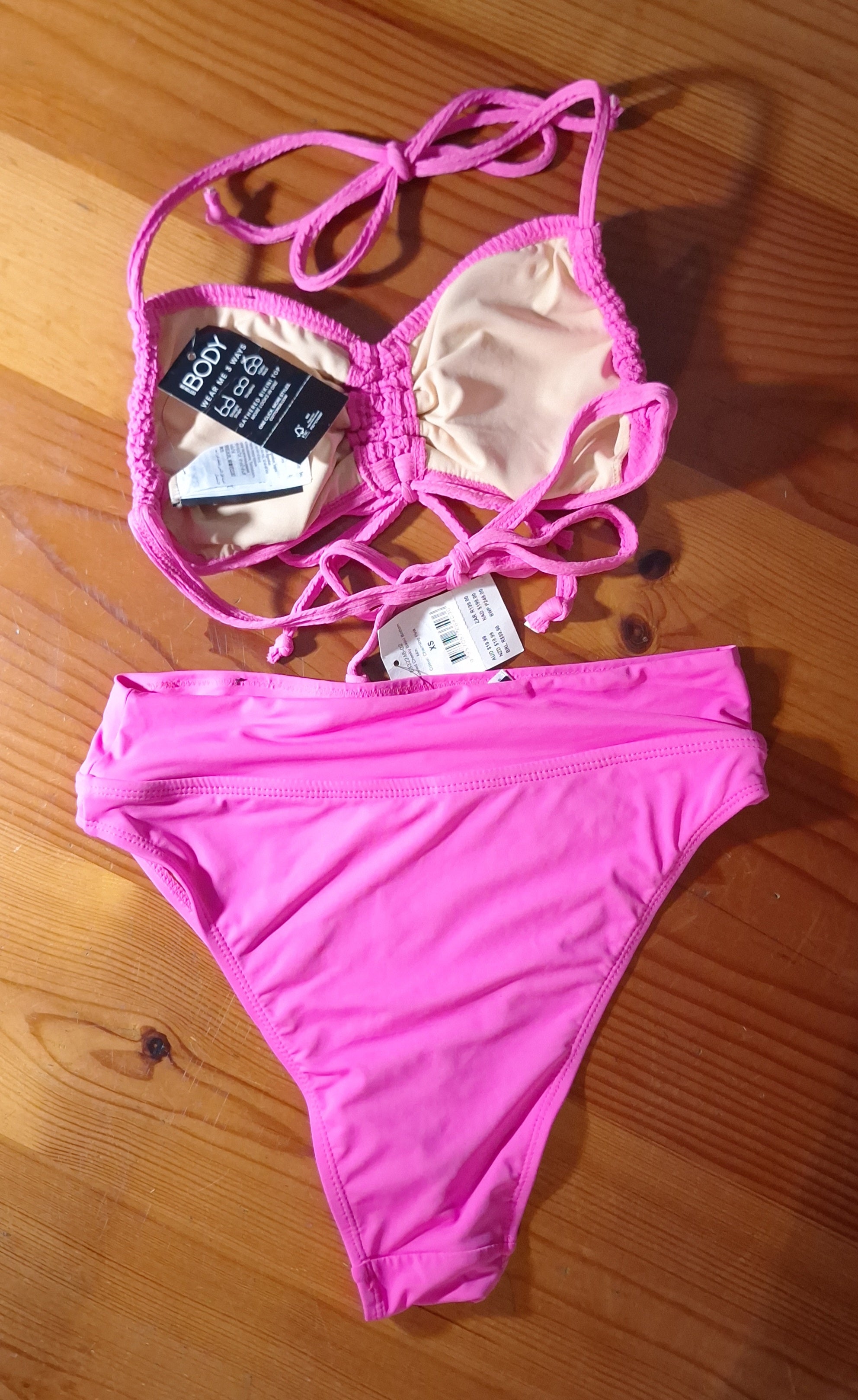 Cotton On Bikini Set  Gathered Backless Halter Bikini Top. Colour: Aurora Pink Crinkle.  High-Waisted Cheeky Bikini Bottom. Colour: Charming Pink.