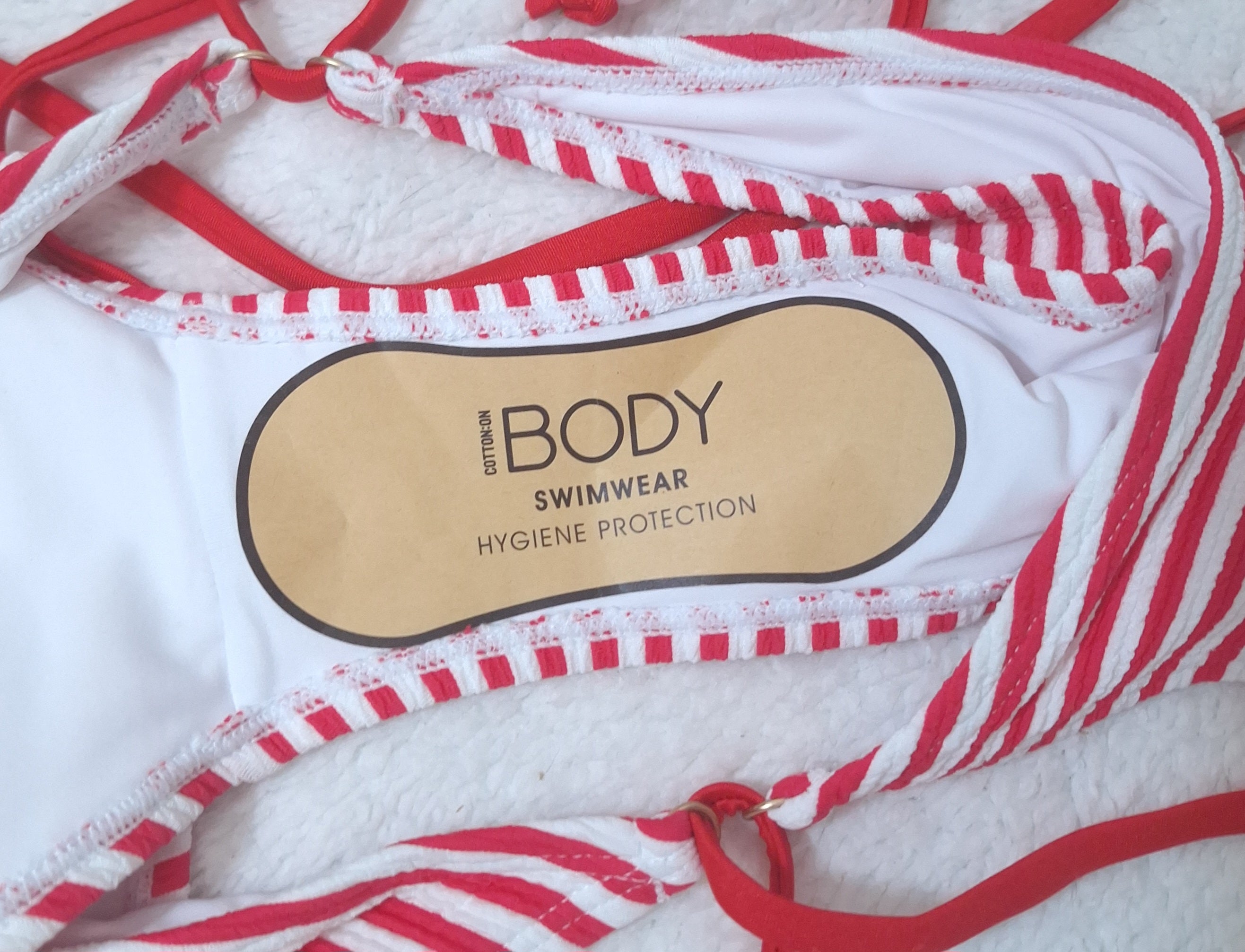 Cotton On U Front Bandeau Bikini Top Colour: Lobster Red, Fixed Tie Side Cheeky Bikini Bottom Colour: Lobster Red Crinkle Stripe